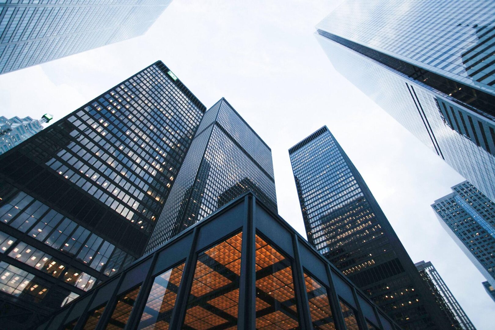 A group of tall buildings with a sky background